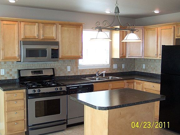 Kitchen with custom tile and island