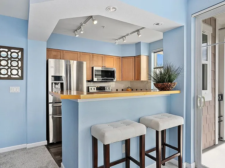 Kitchen with bar top seating