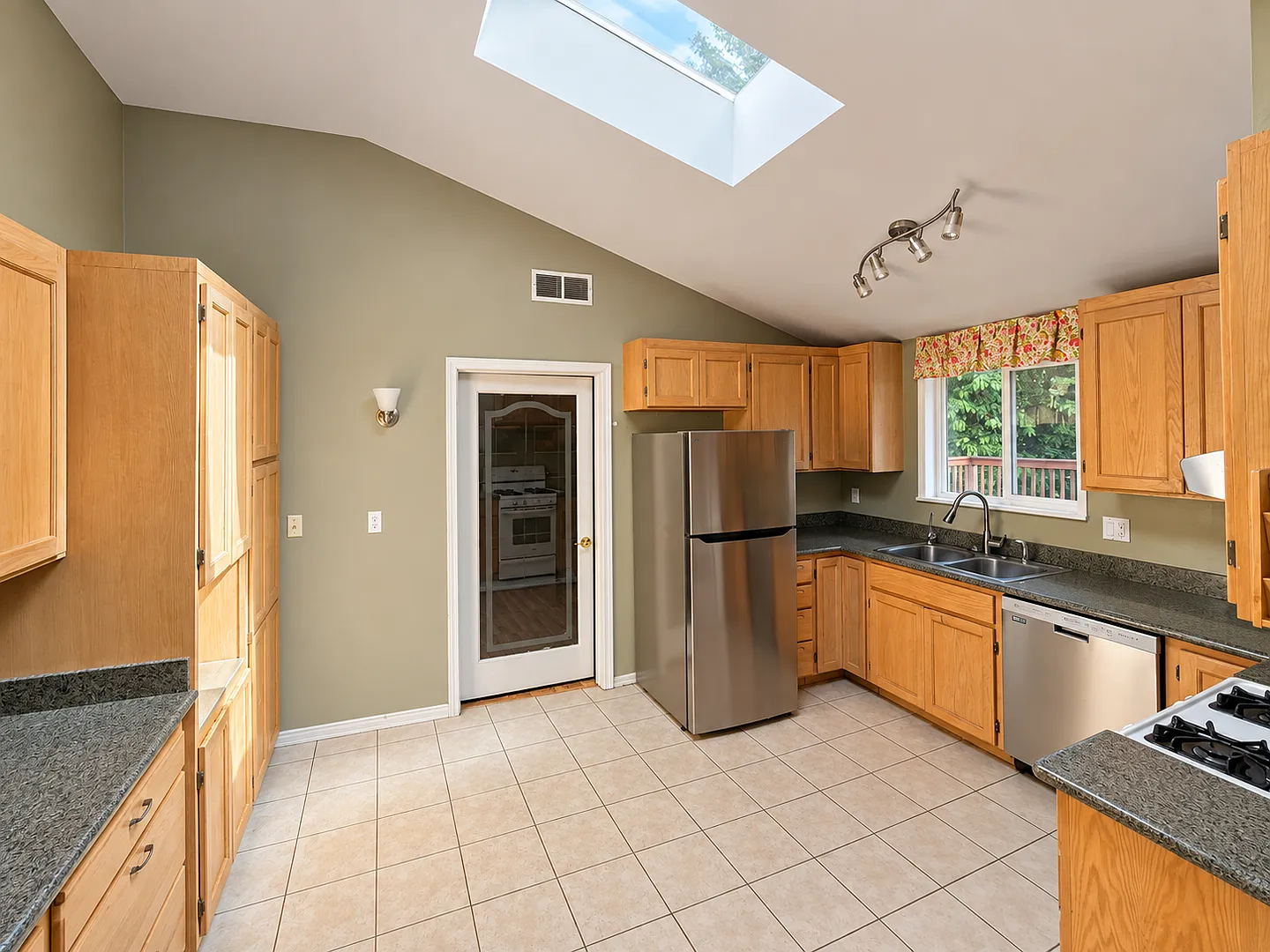 3BD|2BA - Home with Skylights, Updated Kitchen, and Private Outdoor Space — Photo 4