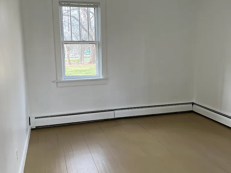 Bedroom.
1 - North facing window.
Hardwood flooring.