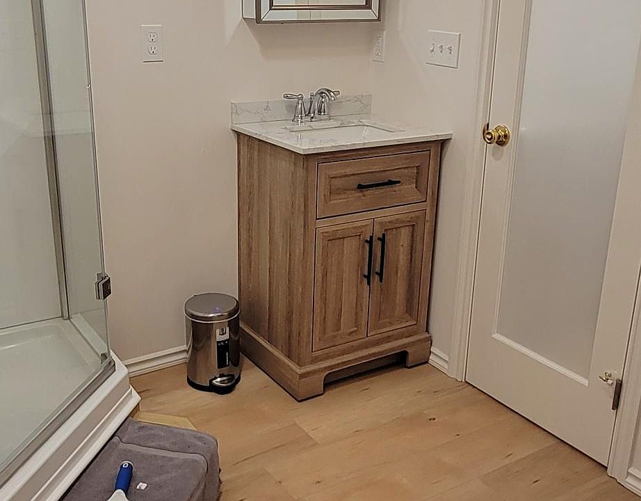 Bathroom and Dressing area. Closet for hanging clothes, 4 drawer dresser for folding clothes, plus extra room for storage .
Door opens to the kitchen area.