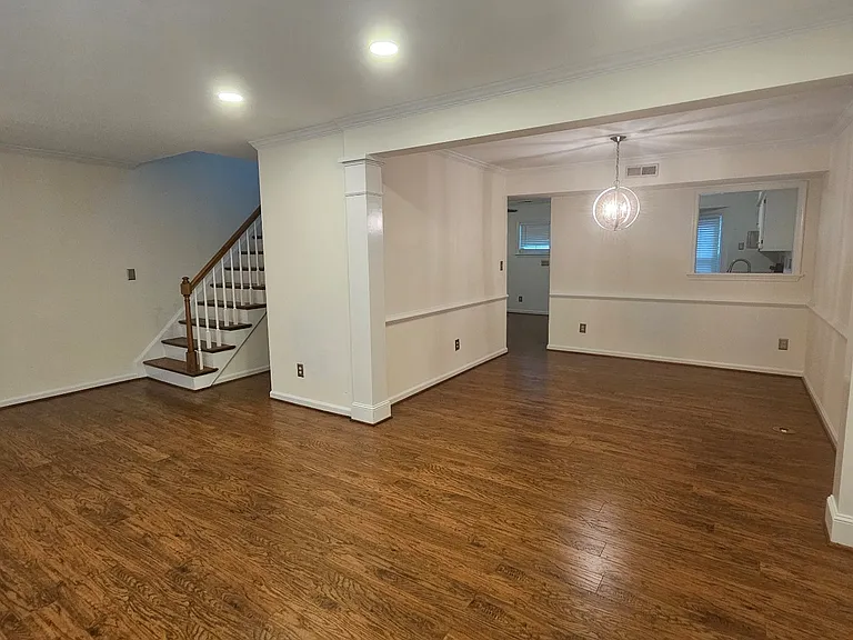 Living room to dining room and a peek into the kitchen