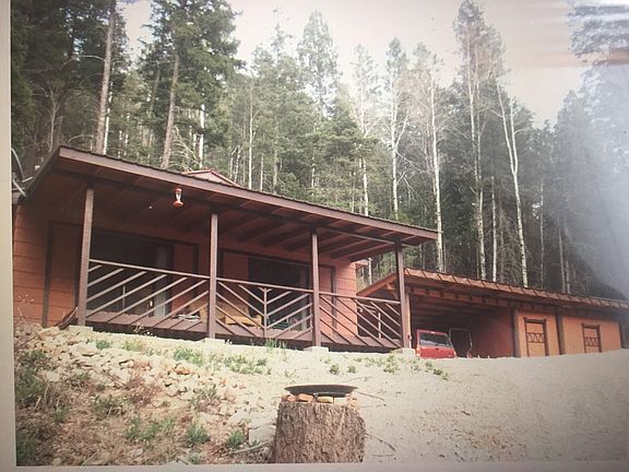 The property enjoys an Aspen grove mixed with fir and a scattering of old-growth trees.