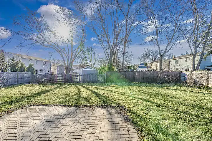 back yard with brick patio