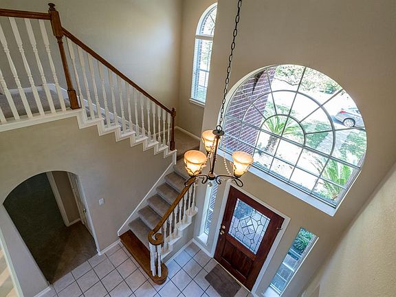 Nice view of the two-story entry shows off this elegant chandelier.
