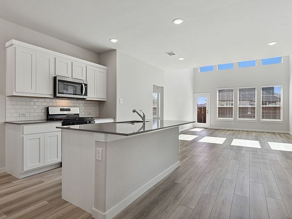 Kitchen in the Mesquite home plan by Trophy Signature Homes - REPRESENTATIVE PHOTO