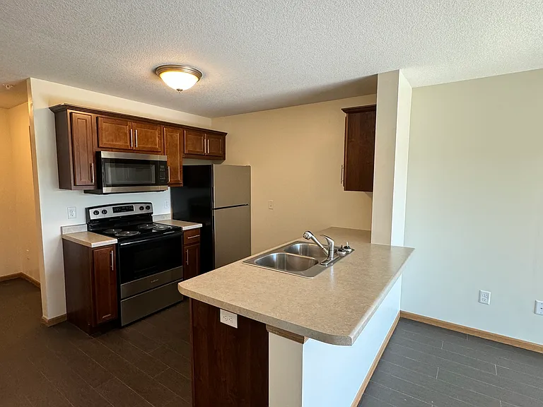 Kitchen, includes: Electric Stove/Oven, Refrigerator/Freezer, Dishwasher and Microwave.