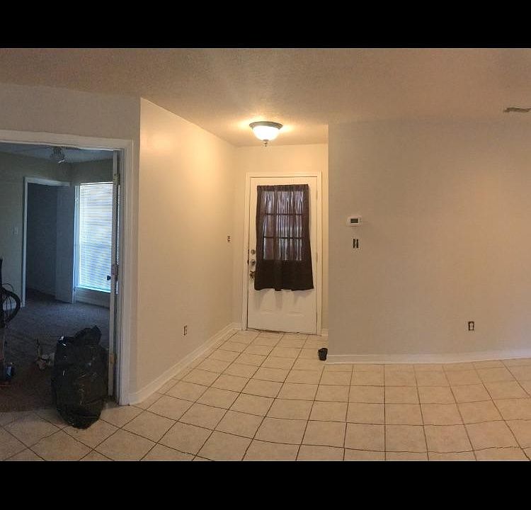 front door, bedroom/office to left w/ french doors