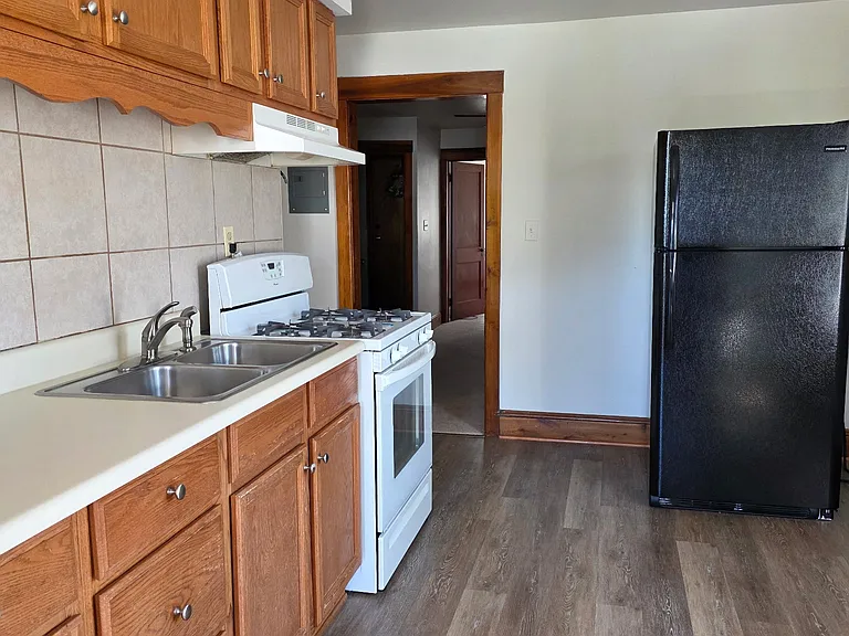 Kitchen with Gas stove, vinyl plank flooring,