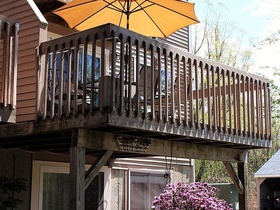 Back of unit. Walk out basement with patio, main level balcony, and 2nd balcony off master bedroom.