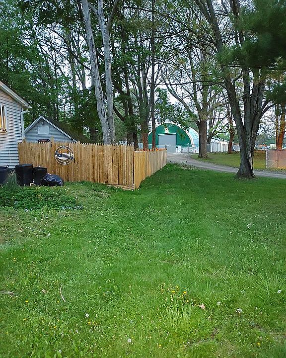 Side of house to fenced yard