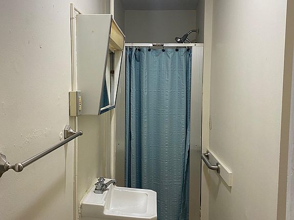 Bathroom has a shower stall
