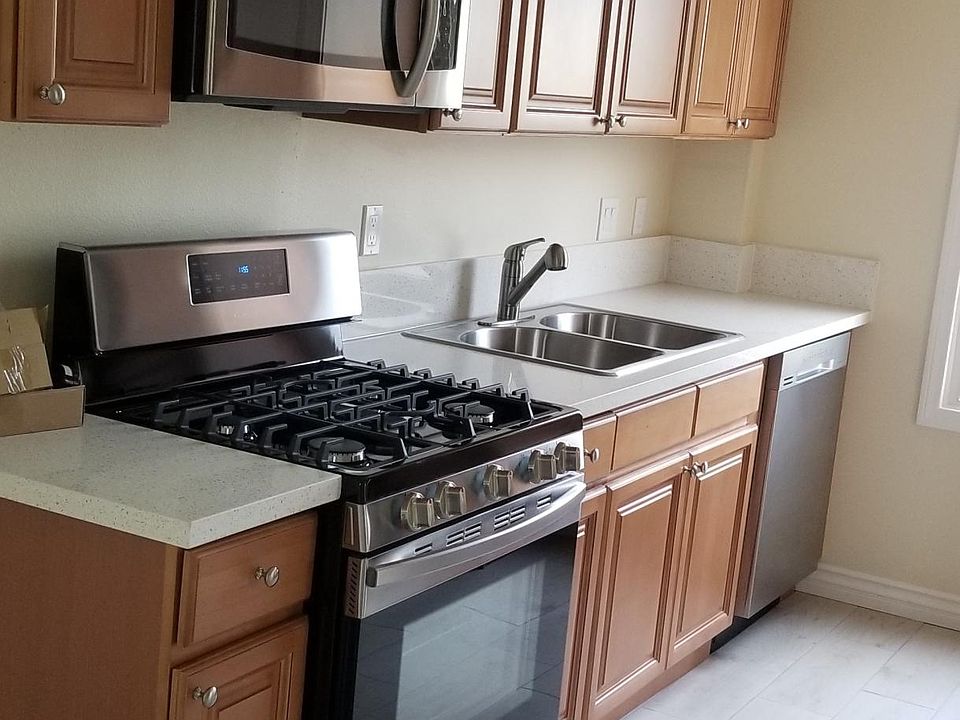 All brand new stainless steel appliances, new quartz counter, new cabinets, new lighting, and new floor tiles.