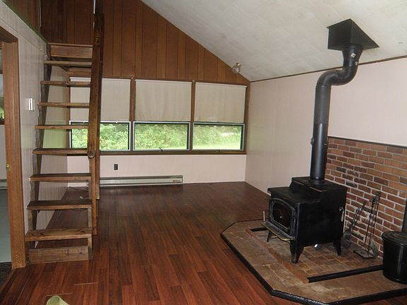 living room & dining room. Steps up to loft storage