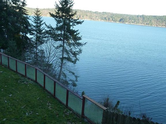 Looki across Colvos Passage at sunrises, boats and birds, and Vashon Island whose windows reflect golden sunsets!