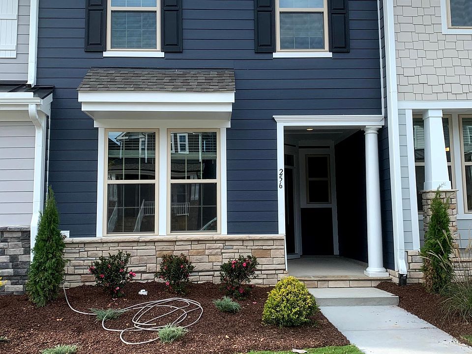 Front of house with covered patio space