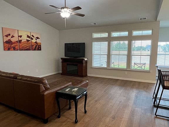 large great room - ceiling fan and blinds installed.