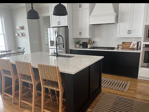 Quartz counter tops and Kitchen Aid appliances all included