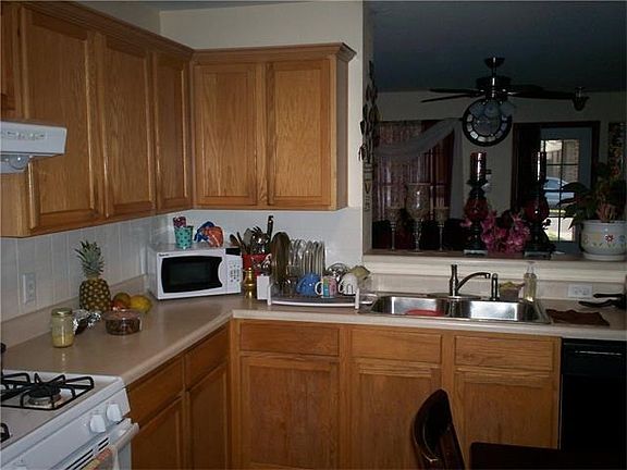Well Maintained Kitchen Looking back into the Living Room