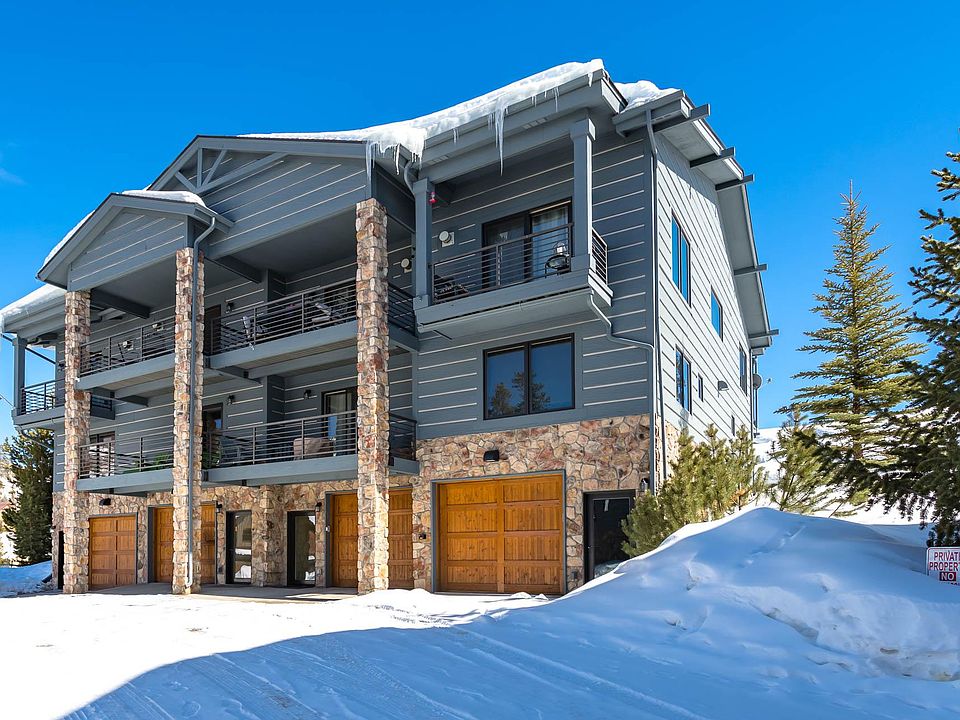 View of building from outside. Unit is second from the left. Heated two car tandem parking.