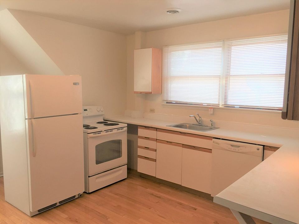 Updated kitchen with stove and refrigerator
