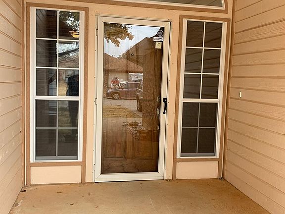Well placed windows bring lots of light inside. Storm door locks.