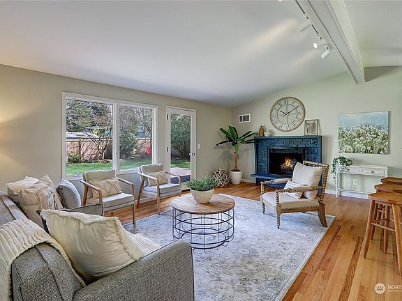 Living room with vaulted ceilings and beautiful hardwood flooring.