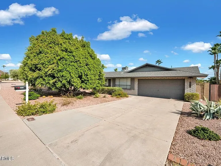 Front of the house. 2-car garage.