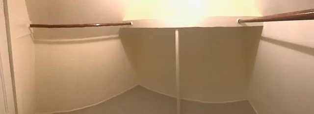 Panoramic of walk in closet in Master