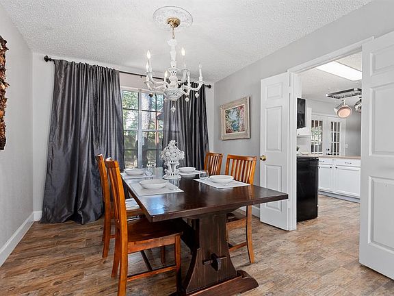 And whether a party of 2 or 8, no gathering is complete without an elegant dedicated dining space for family dinners OR Bunco night with friends - bridging the space between the formal living and the gorgeous kitchen. A large picture window offers a 