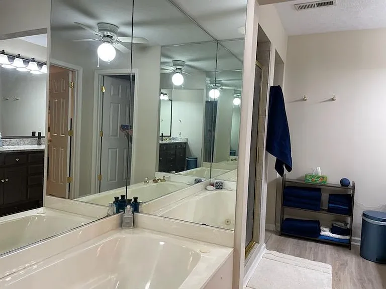 Primary ensuite with jet tub and walk-in shower