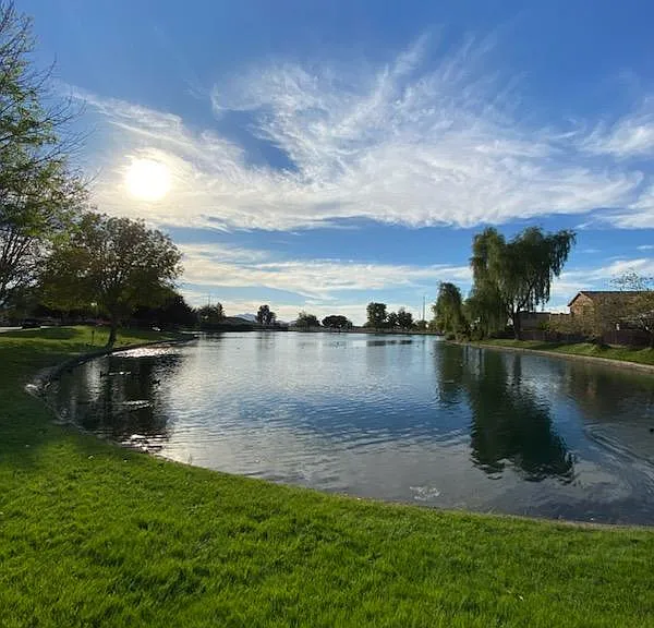 Lush green lawn surrounds the beautiful community lake at Cottonfields gated community. Picture taken November 13, 2023.