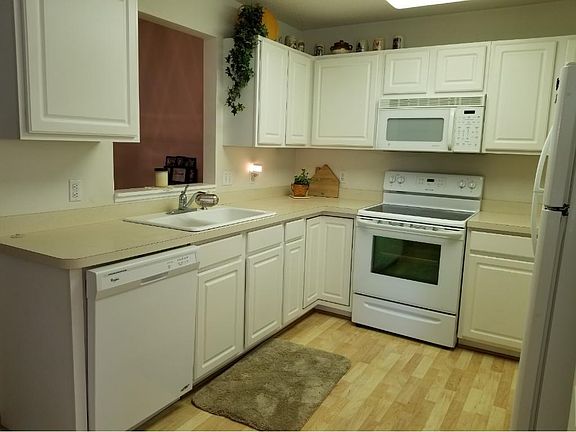 Bright kitchen with hardwood floors.