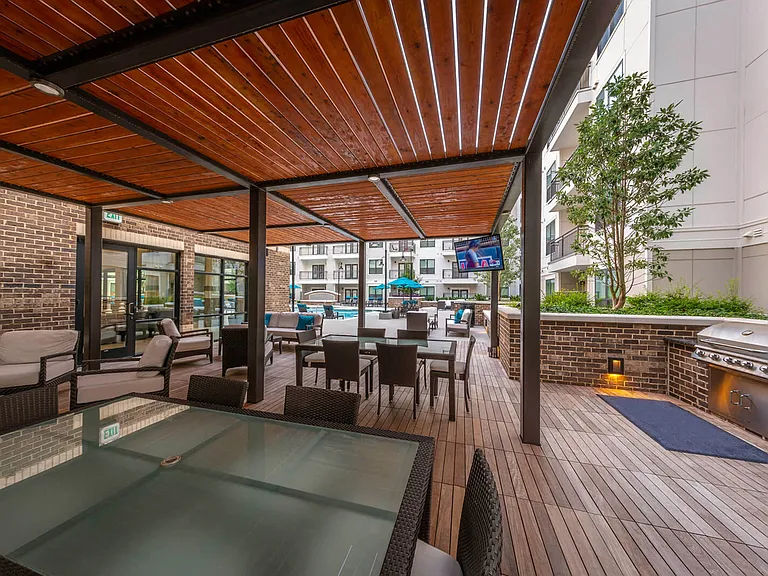Entertain and dine outdoors with family and friends in the covered courtyard with grilling stations
