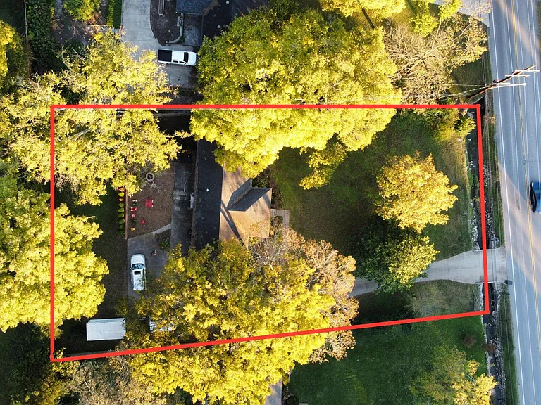 approximate boundary of the property; slopes upward front to back; .5 acres!