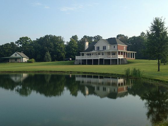 Porch 3 sides, pillars, pond