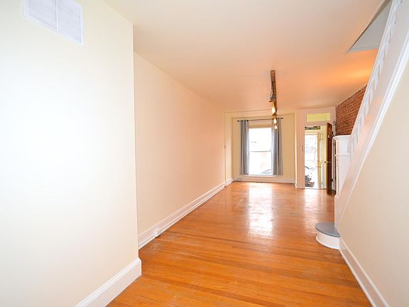 Open floor plan with hardwood floors