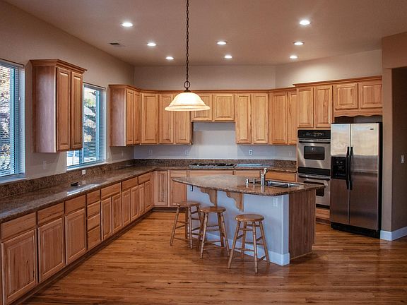 Huge kitchen with stainless steel appliances and room for a breakfast table