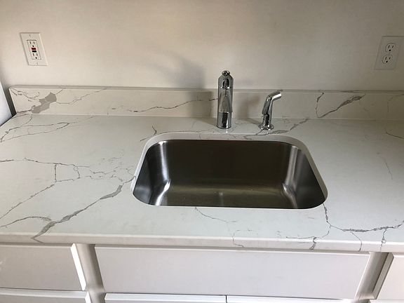 Kitchen Kohler Faucet and Sink with Quartz Countertops