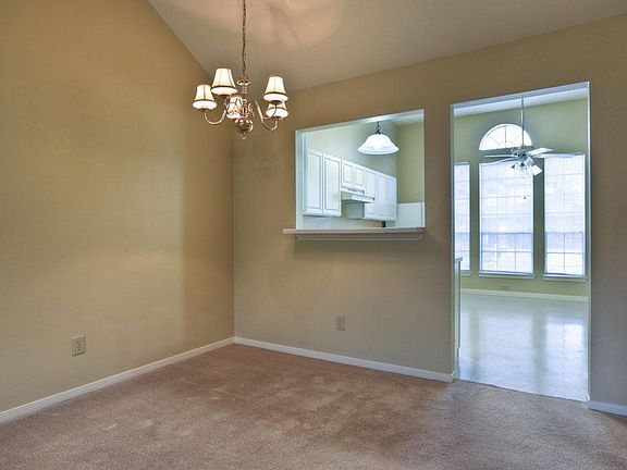View of the dining room looking into the kitchen.