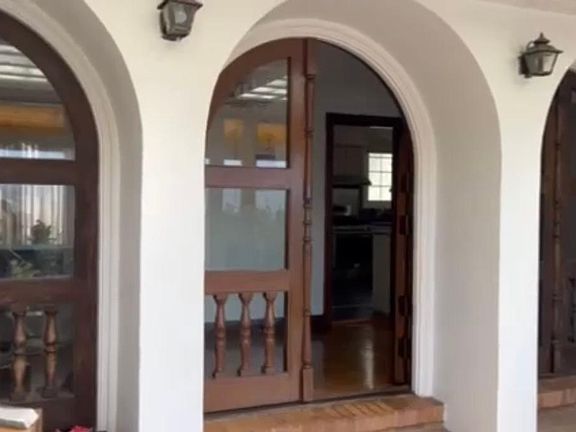 Grand architecture in sunroom entryway
