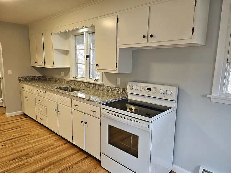 Kitchen area (new, sleek Microwave on order)