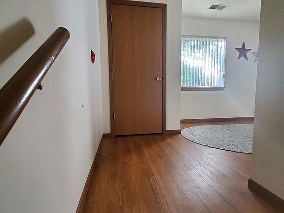 Coat closet at top of stairs