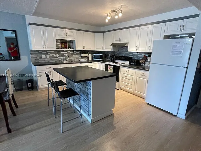 2061 NW 47th Ter #205 — Photo 34