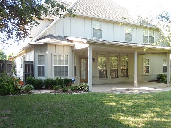 Shaded backyard
						:
						Covered patio with half-moon flagstone extension.