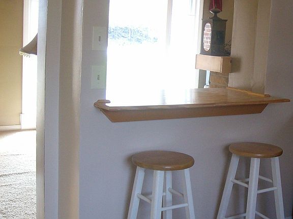 Bar in kitchen looking into Living room