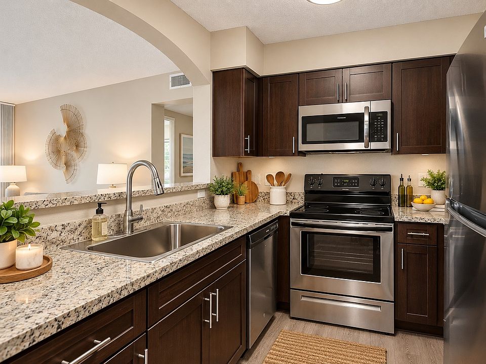 Elevate your cooking experience in Mosaic's modern kitchen, featuring sleek stainless steel appliances and elegant granite countertops. Perfectly designed for convenience and style. Schedule your visit today and see it for yourself!