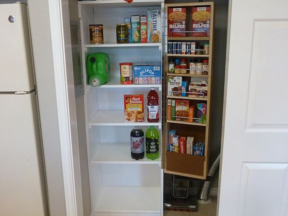 Swinging shelf with spice rack and dry storage