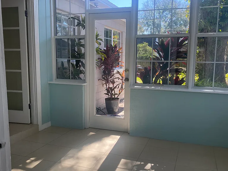 sunroom leading out to paver patio