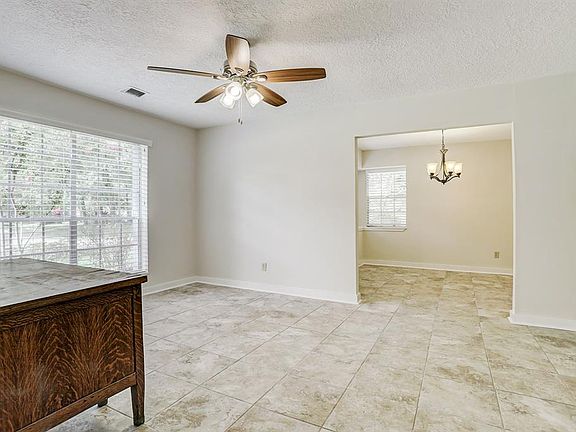FORMAL LIVING OR STUDY WITH RECENT TILE FLOORS.